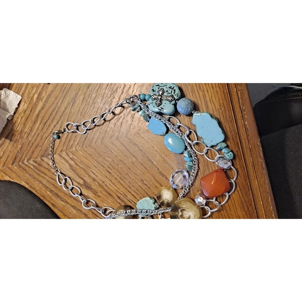 Southwestern-style statement piece featuring multiple strands of silver-toned...